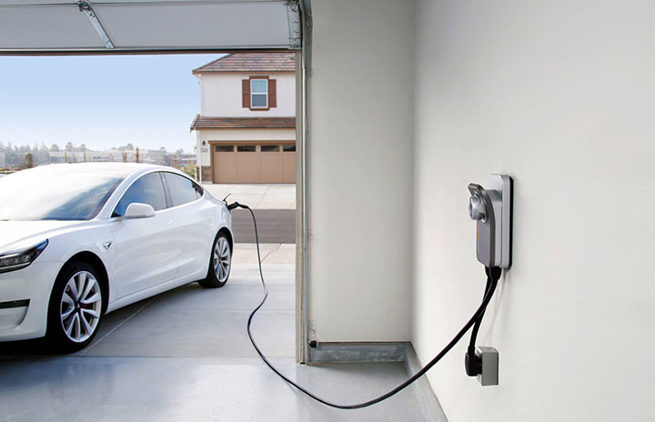 Tesla plugged into a home car charger