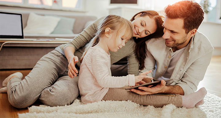 Family sharing a tablet