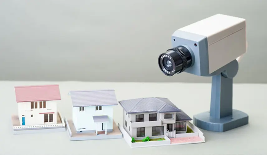 Camera above miniture houses